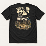 Back By Dark tee in Vintage Black, back flat lay showing We'll Be Back By Dark above a lifted white rig, moon and broken driveshaft pieces.
