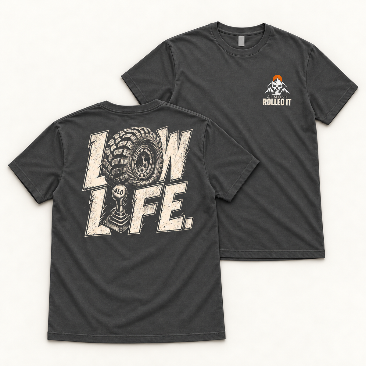 Front and back flat lays of the Dark Grey Low Life tee, showing the small orange-sun ARI chest mark and cream LOW LIFE back print.