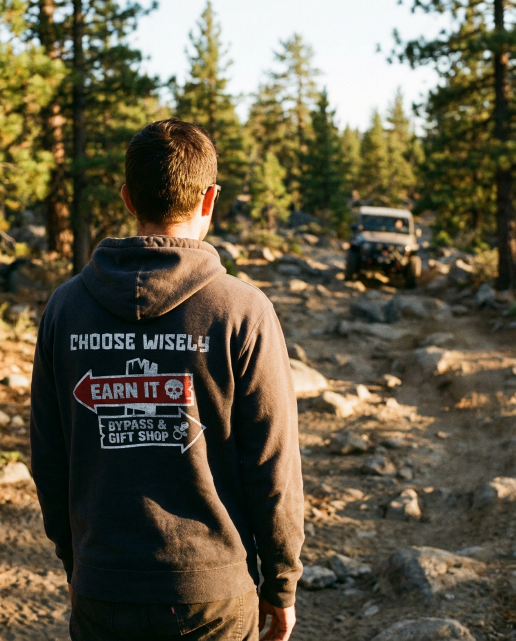 Dark charcoal full-zip hoodie featuring the Almost Rolled It 'Choose Wisely' skull and wrench graphic. - Black full-zip hoodie with the 'Choose Wisely' graphic for off-road enthusiasts. - ARI Choose Wisely Hoodie featuring a bold, weathered-style graphic that captures the gritty spirit of off-road life. - Back View