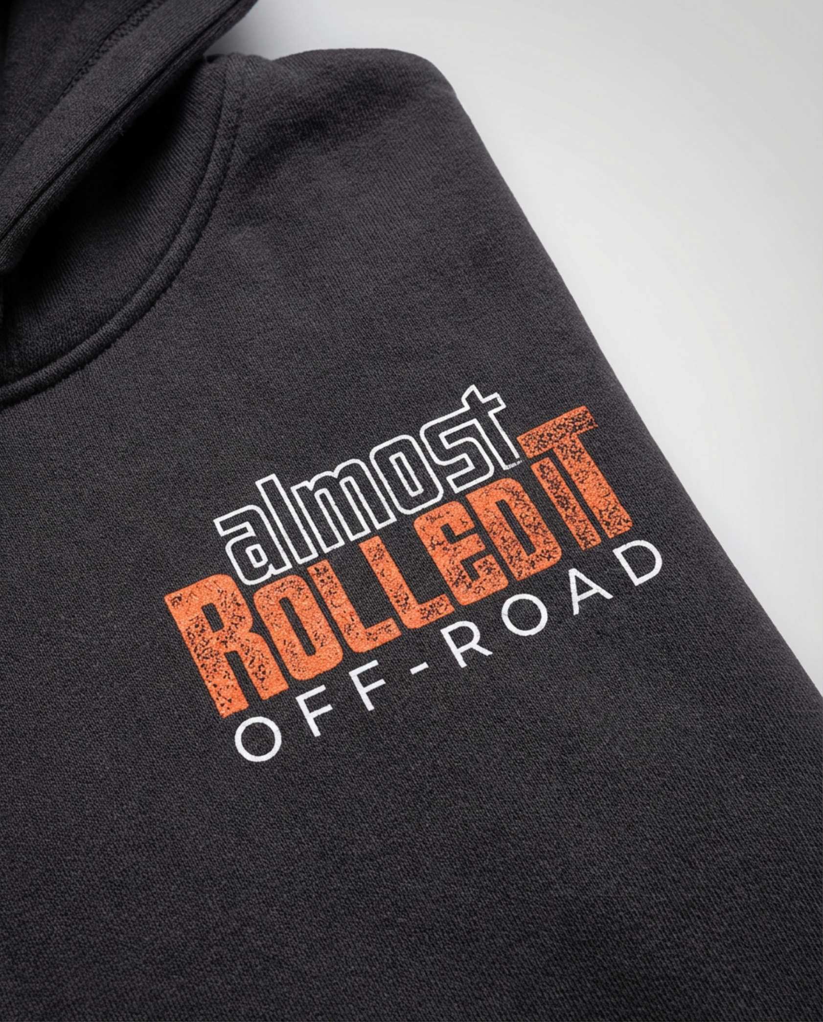 Dark charcoal full-zip hoodie featuring the Almost Rolled It 'Choose Wisely' skull and wrench graphic. - Black full-zip hoodie with the 'Choose Wisely' graphic for off-road enthusiasts. - ARI Choose Wisely Hoodie featuring a bold, weathered-style graphic that captures the gritty spirit of off-road life. - Back View