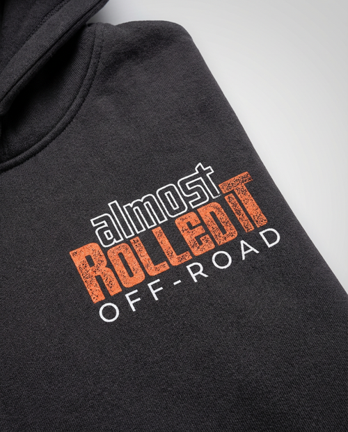 Dark charcoal full-zip hoodie featuring the Almost Rolled It 'Choose Wisely' skull and wrench graphic. - Black full-zip hoodie with the 'Choose Wisely' graphic for off-road enthusiasts. - ARI Choose Wisely Hoodie featuring a bold, weathered-style graphic that captures the gritty spirit of off-road life. - Back View