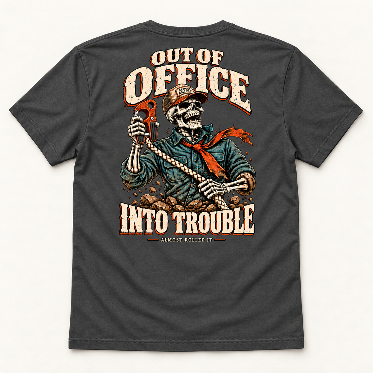 Out of Office tee in Dark Grey, back flat lay showing the skeleton recovery graphic and Out of Office Into Trouble lettering.