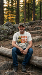 Dark charcoal graphic t-shirt featuring the 'Duck Duck Nope' design in a hand-detailed, gritty style for off-road enthusiasts. - IVORY - FRONT