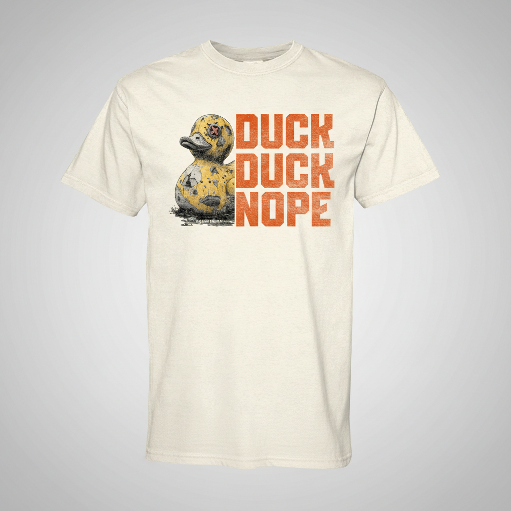 Dark charcoal graphic t-shirt featuring the 'Duck Duck Nope' design in a hand-detailed, gritty style for off-road enthusiasts. - ivory