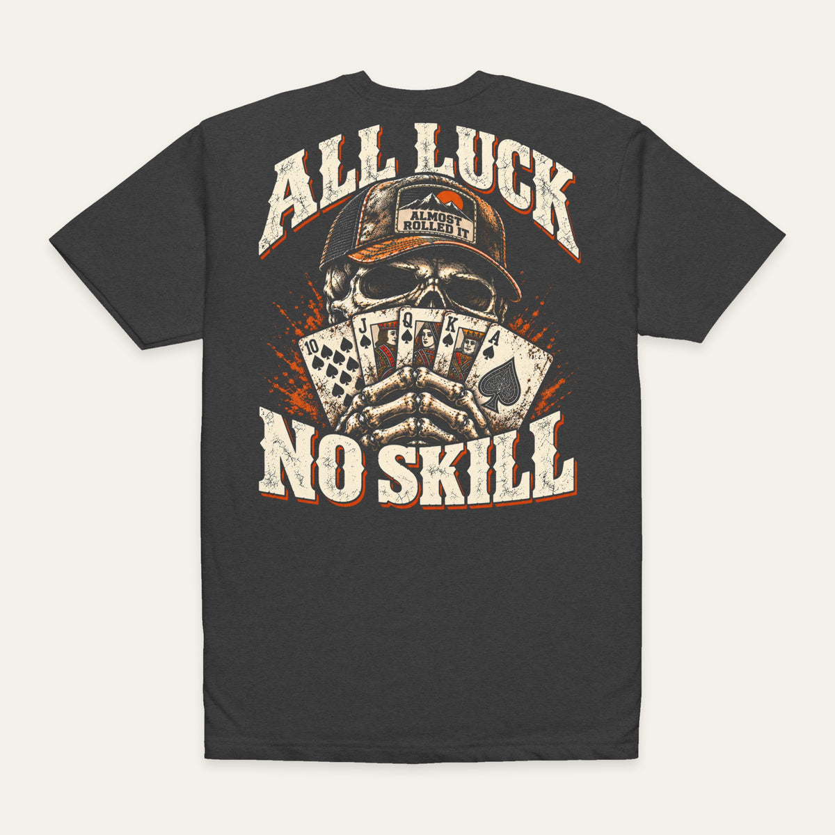 All Luck No Skill Tee in Charcoal — back flat lay. Supplier-derived product mockup; artwork and placement preserved.