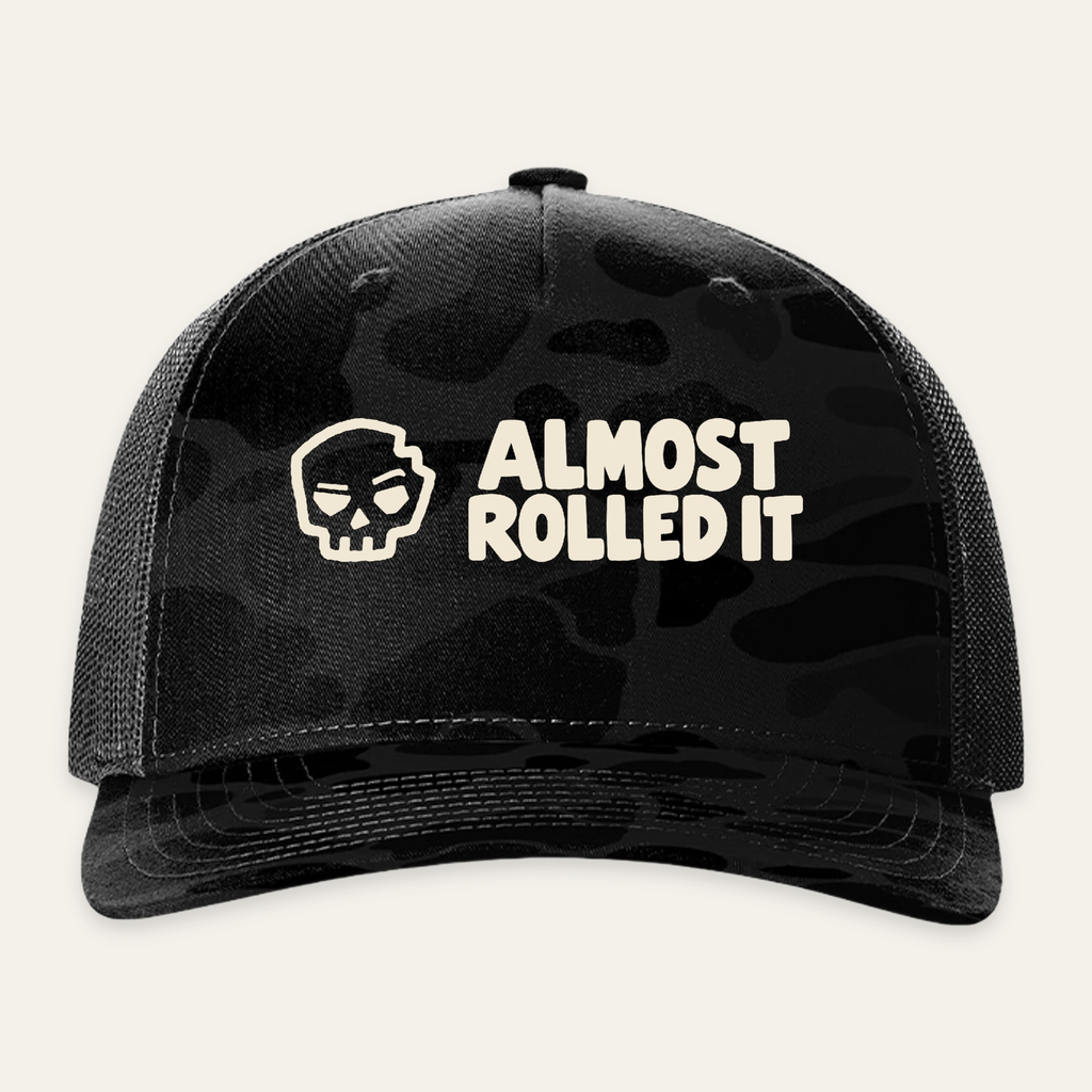 ARI Logo Trucker Hat in Sable Duck Camo/ Black — front flat lay