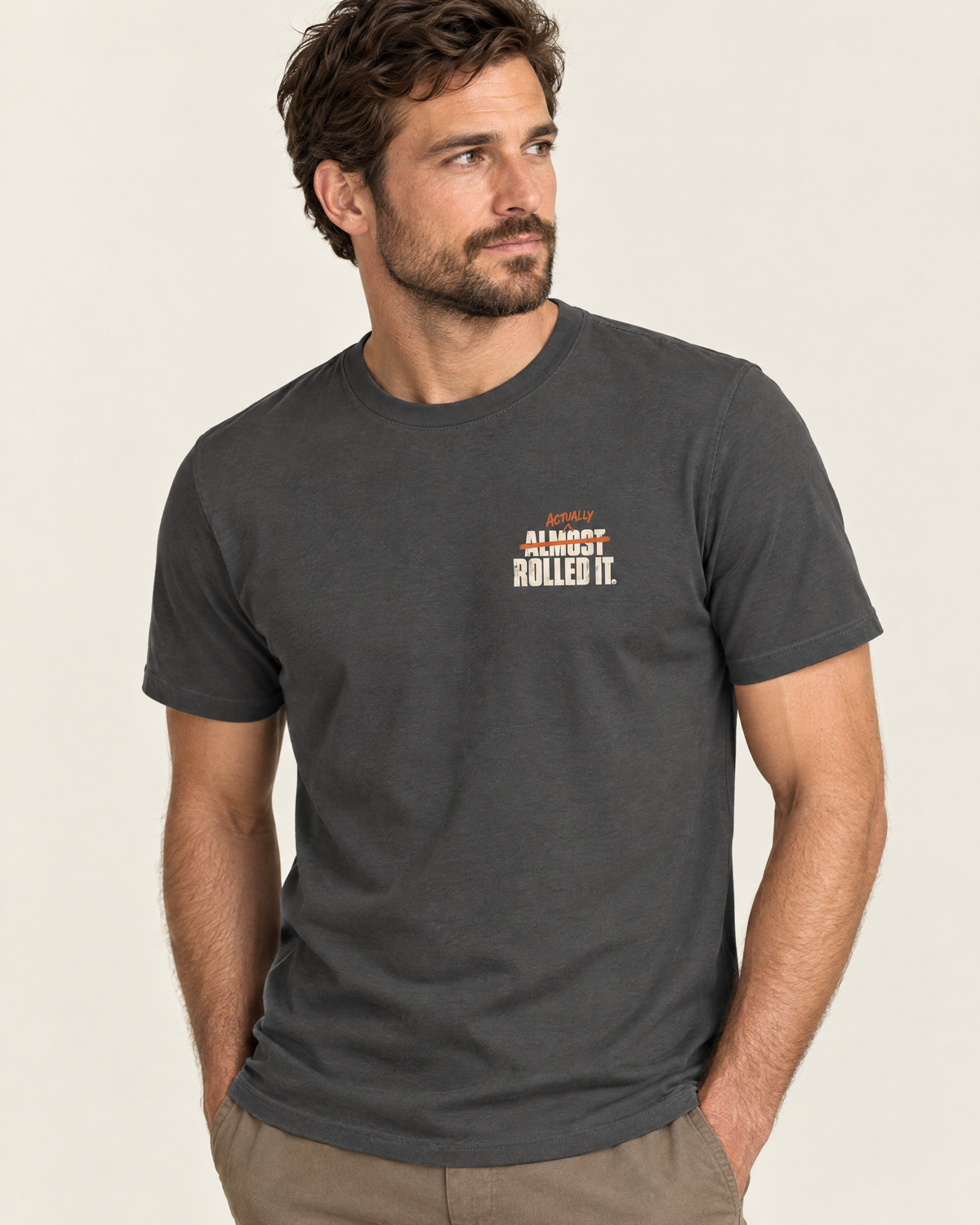 Front of the Actually Rolled It tee on a model: small chest logo