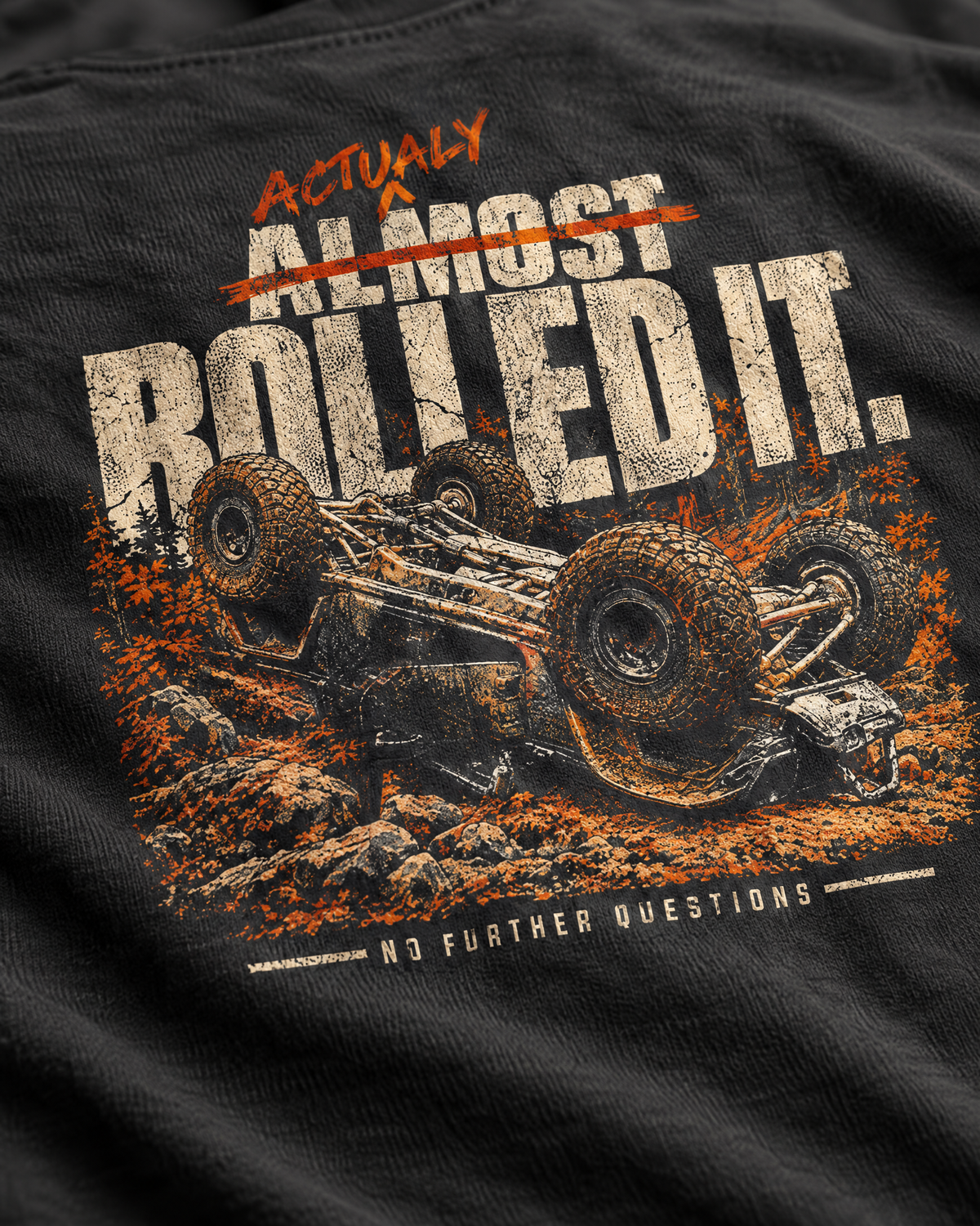 Close-up of the Actually Rolled It print: distressed cream and orange ink on cotton
