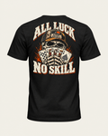 All Luck No Skill tee in vintage black, back view: skull in a trucker cap holding a royal flush of spades, cream and orange lettering