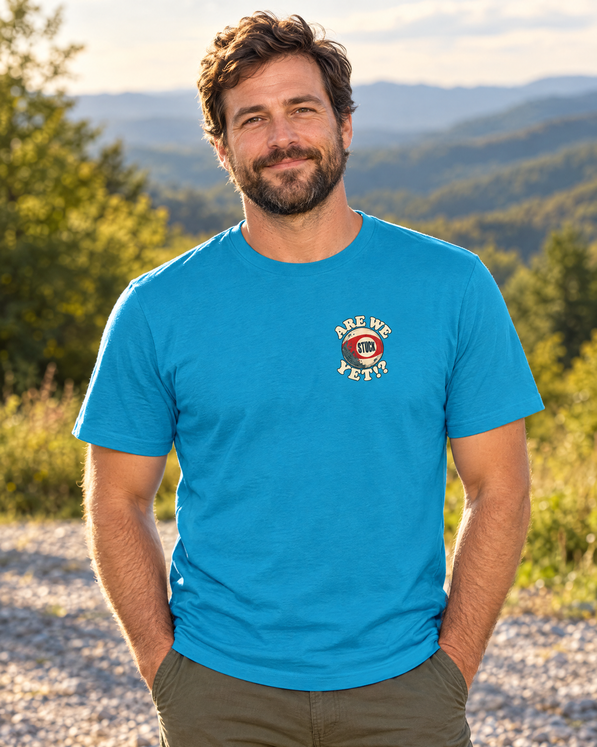 Front of the electric blue Are We Stuck Yet? tee on a model: small Are We Stuck Yet!? bingo ball on the chest