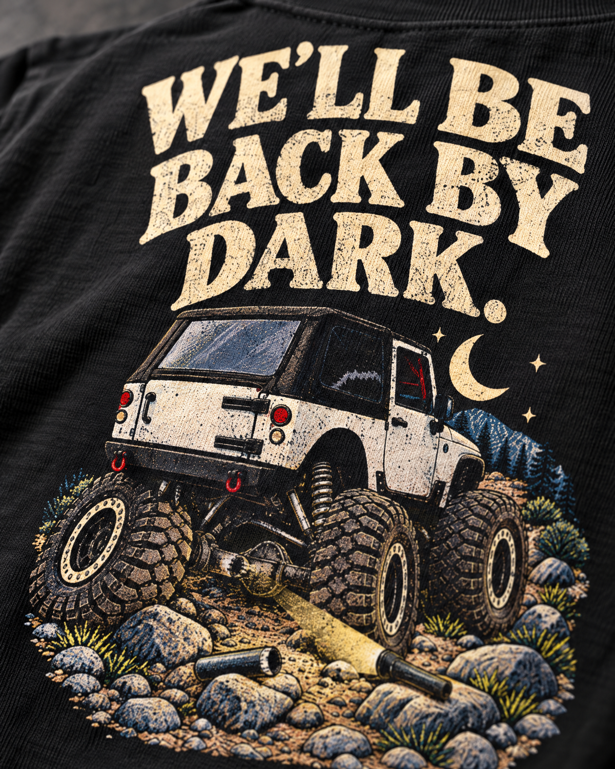 Close-up of the WE'LL BE BACK BY DARK. back print on vintage black cotton