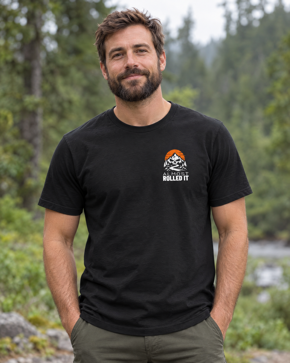 Man wearing the vintage black Back By Dark tee, front view with the small skull-and-mountains ARI logo on the left chest