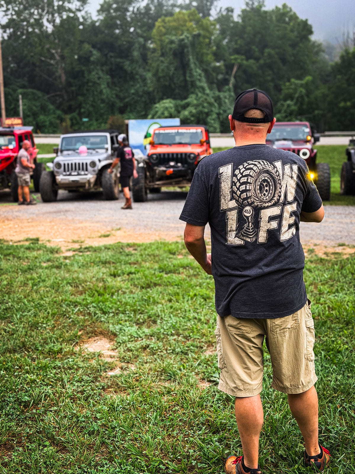 Low Life tee in Vintage Black, full back flat lay showing the cream LOW LIFE tire-and-4LO-shifter print.