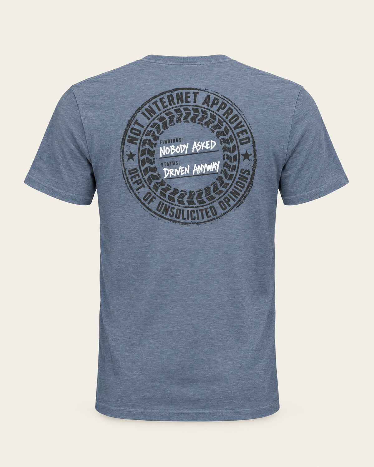 Nobody Asked tee in vintage denim, back view: round charcoal stamp reading Not Internet Approved, Dept. of Unsolicited Opinions, Findings: Nobody Asked, Status: Driven Anyway