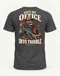 Out of Office tee in dark grey, back view: OUT OF OFFICE, INTO TROUBLE in cream lettering around a laughing skeleton in a trucker cap and red bandana holding a red hook on a rope
