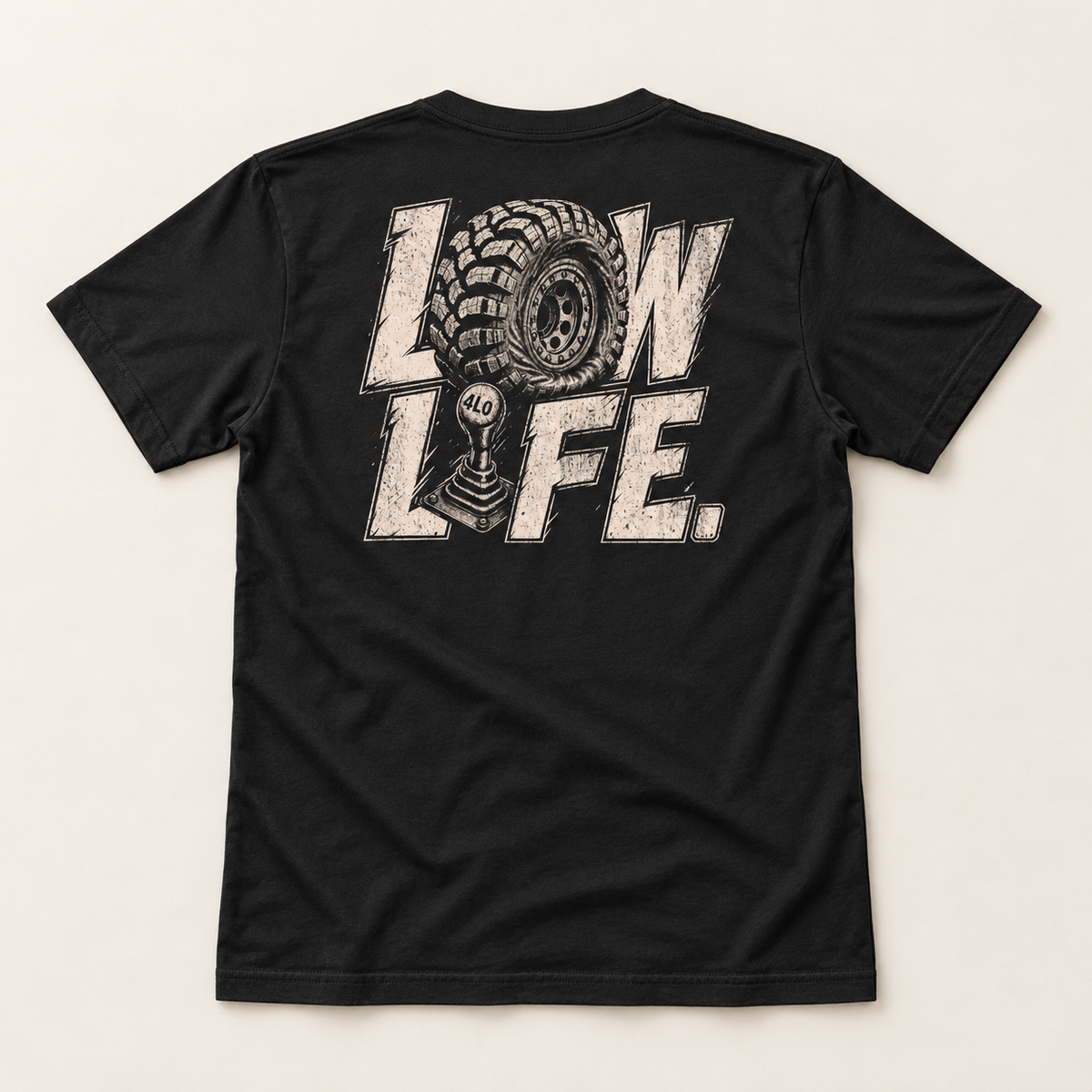 Low Life tee in Vintage Black, full back flat lay showing the cream LOW LIFE tire-and-4LO-shifter print.