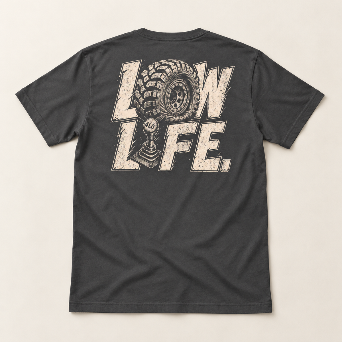 Low Life tee in Dark Grey, full back flat lay showing the cream LOW LIFE tire-and-4LO-shifter print.