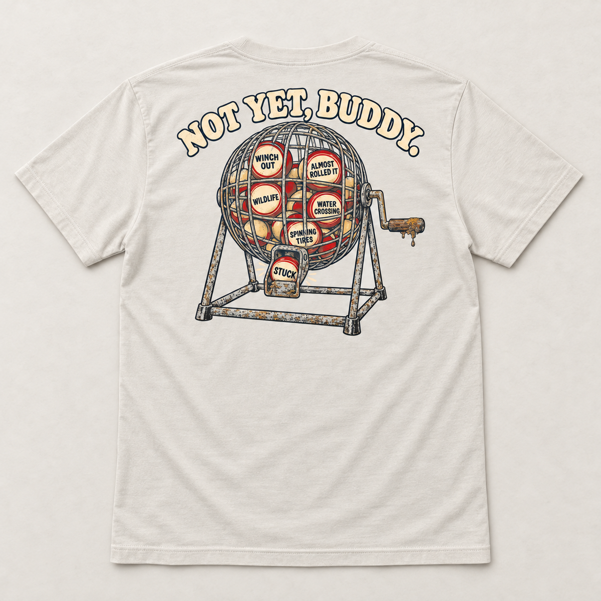 Are We Stuck Yet? adult tee in Vintage White, complete back flat lay showing the Not Yet, Buddy bingo-cage print.