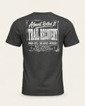 Trail Recovery Badge tee in dark grey, back view: white vintage-sign print reading Almost Rolled It Trail Recovery, winch-outs, bad advice, witnesses