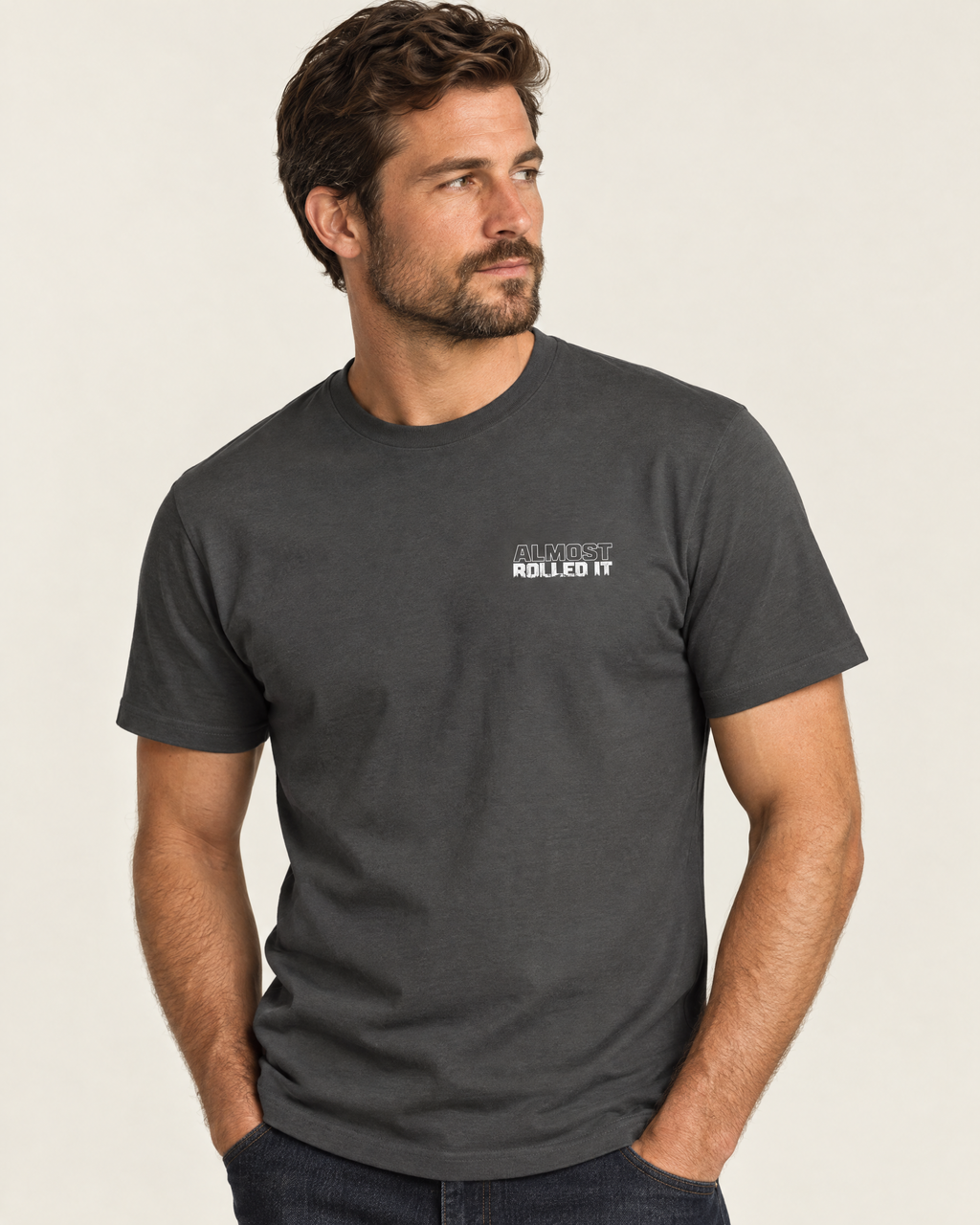 Front of the Trail Recovery Badge tee on a model: small white Almost Rolled It chest logo