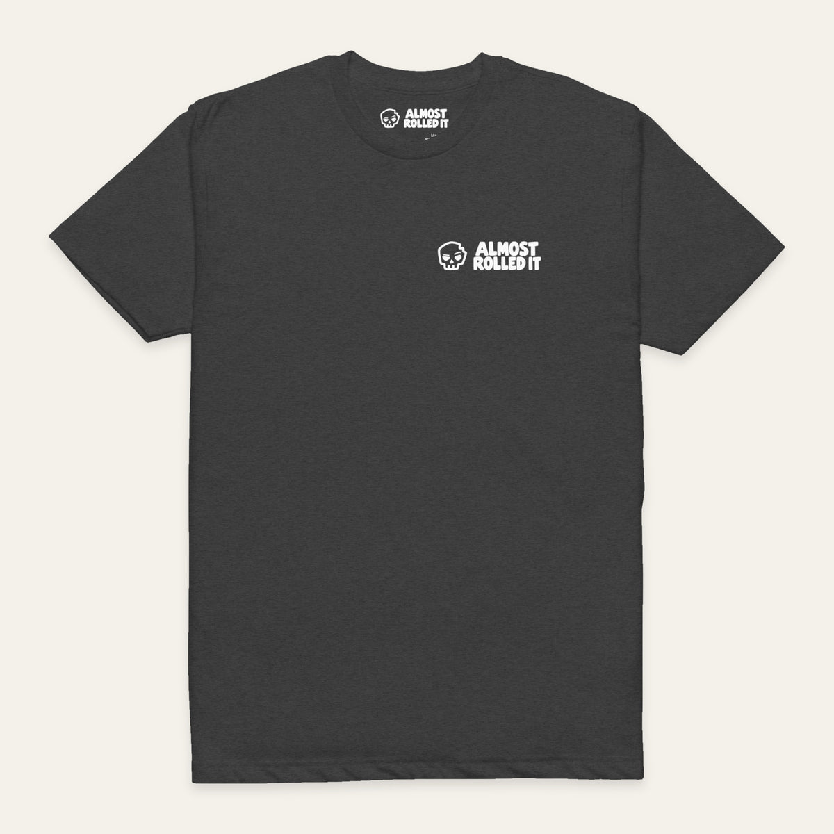 ARI Core Tee in Charcoal — front flat lay. Supplier-derived product mockup; chest artwork and placement preserved.
