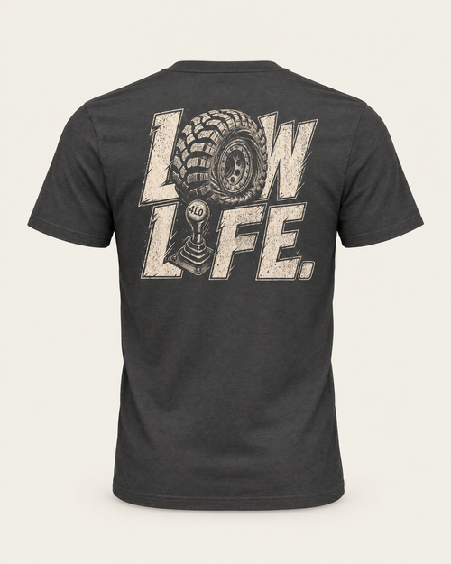 Low Life tee in dark grey, back view: cream LOW LIFE lettering with an off-road tire and 4LO shifter