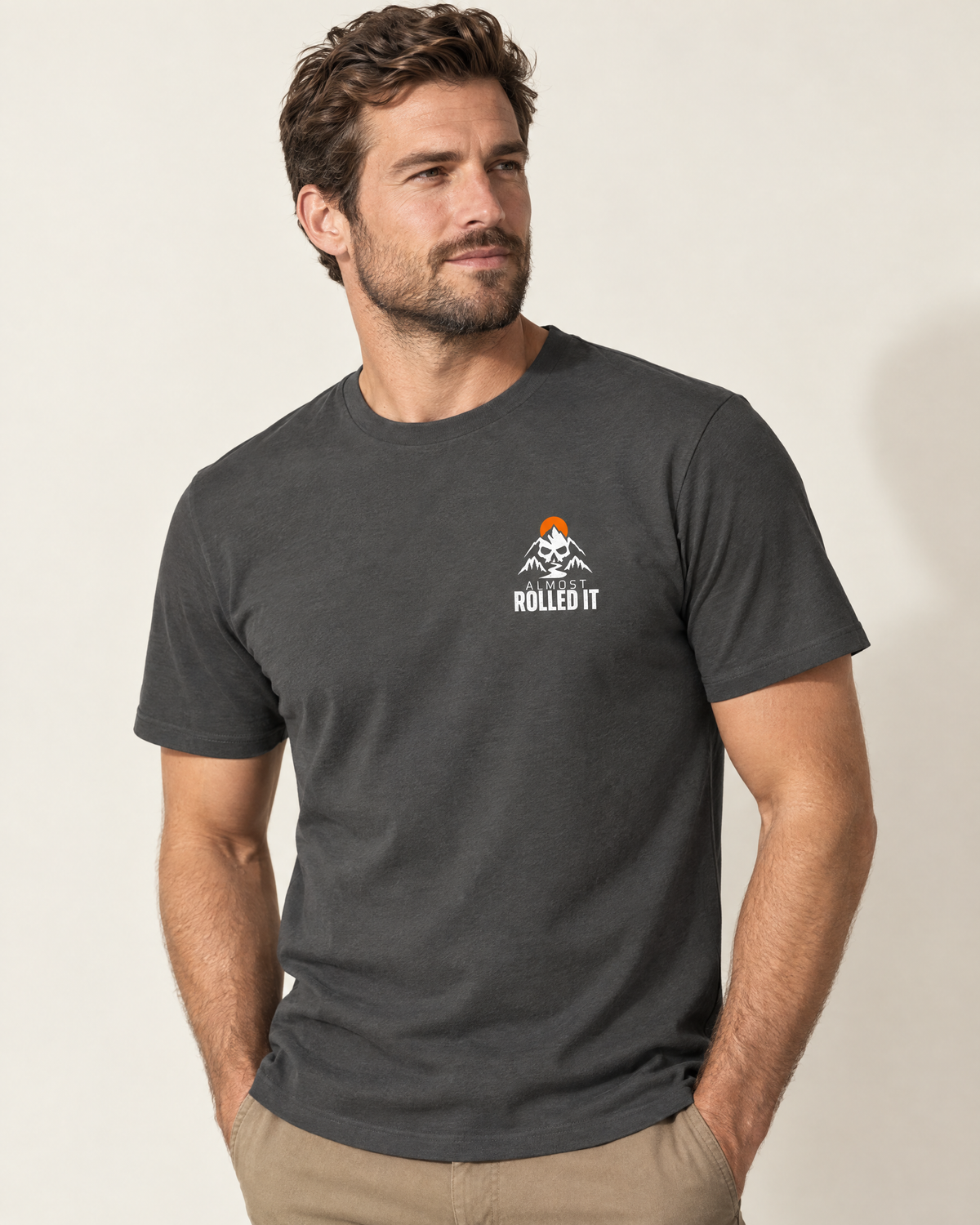 Front of the 4Lo Skull tee on a model: small skull-and-mountains Almost Rolled It chest logo
