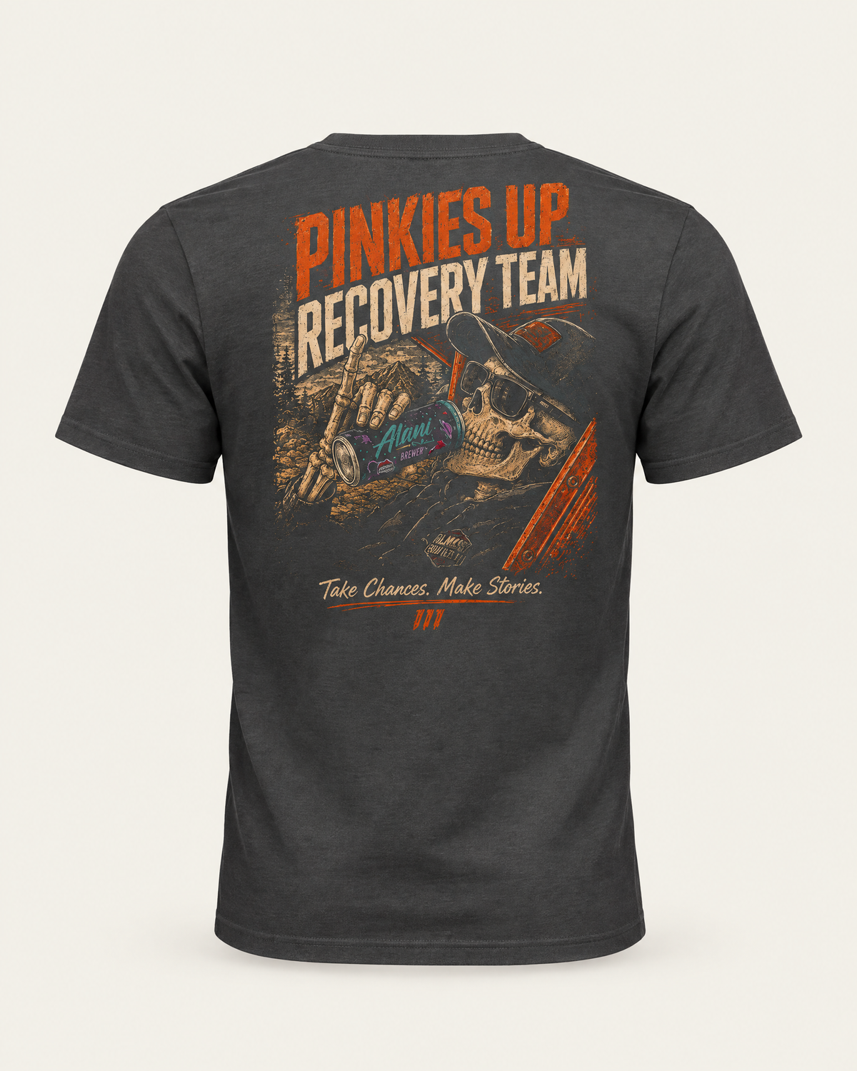 Pinkies Up tee in dark grey, back view: orange Pinkies Up Recovery Team lettering over an illustrated skeleton scene