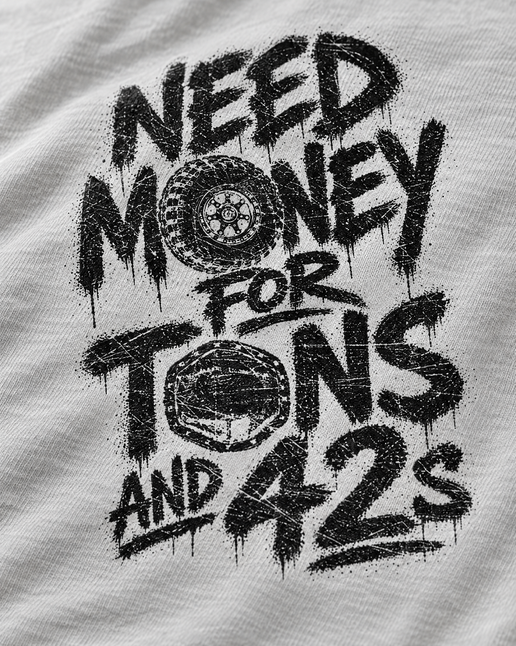 Close-up of the silver Tons & 42s print: black brush lettering on soft cotton