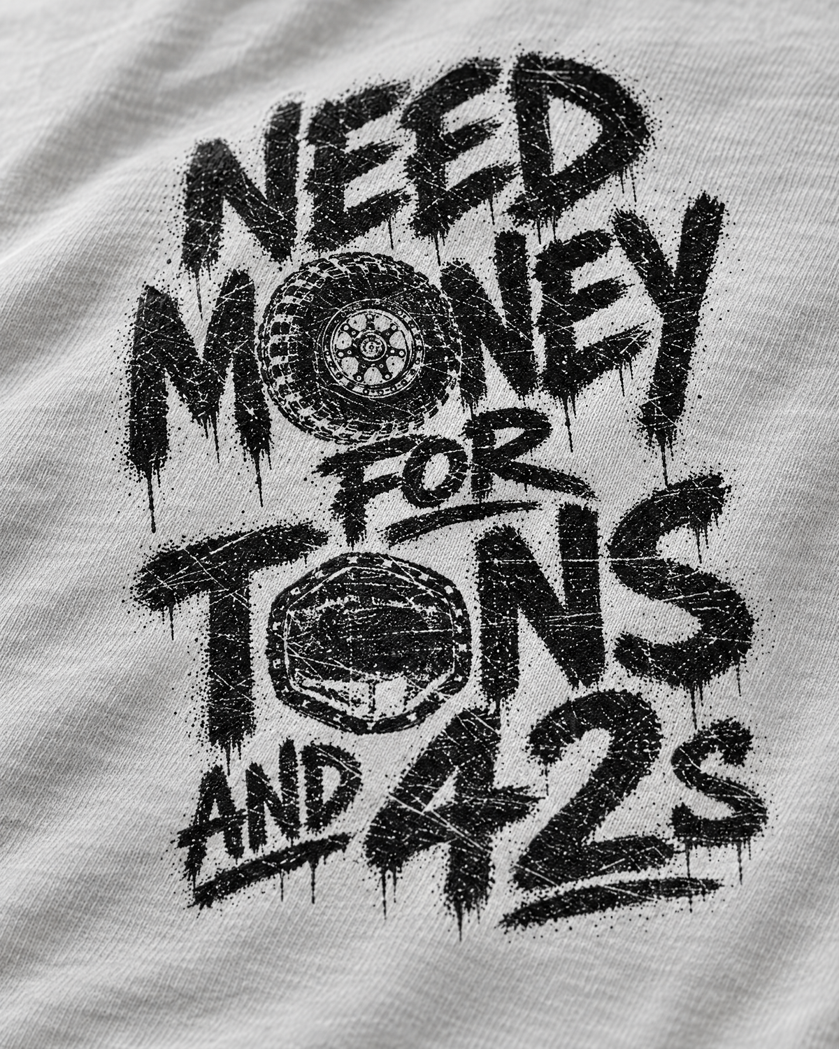 Close-up of the silver Tons & 42s print: black brush lettering on soft cotton