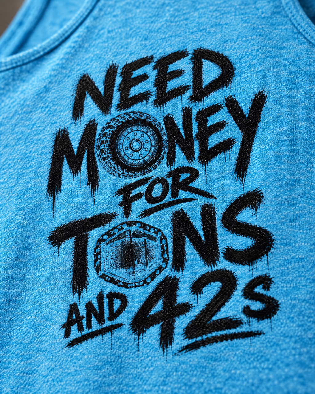 Close-up of the Tons & 42s tank print: black brush lettering on heathered jersey