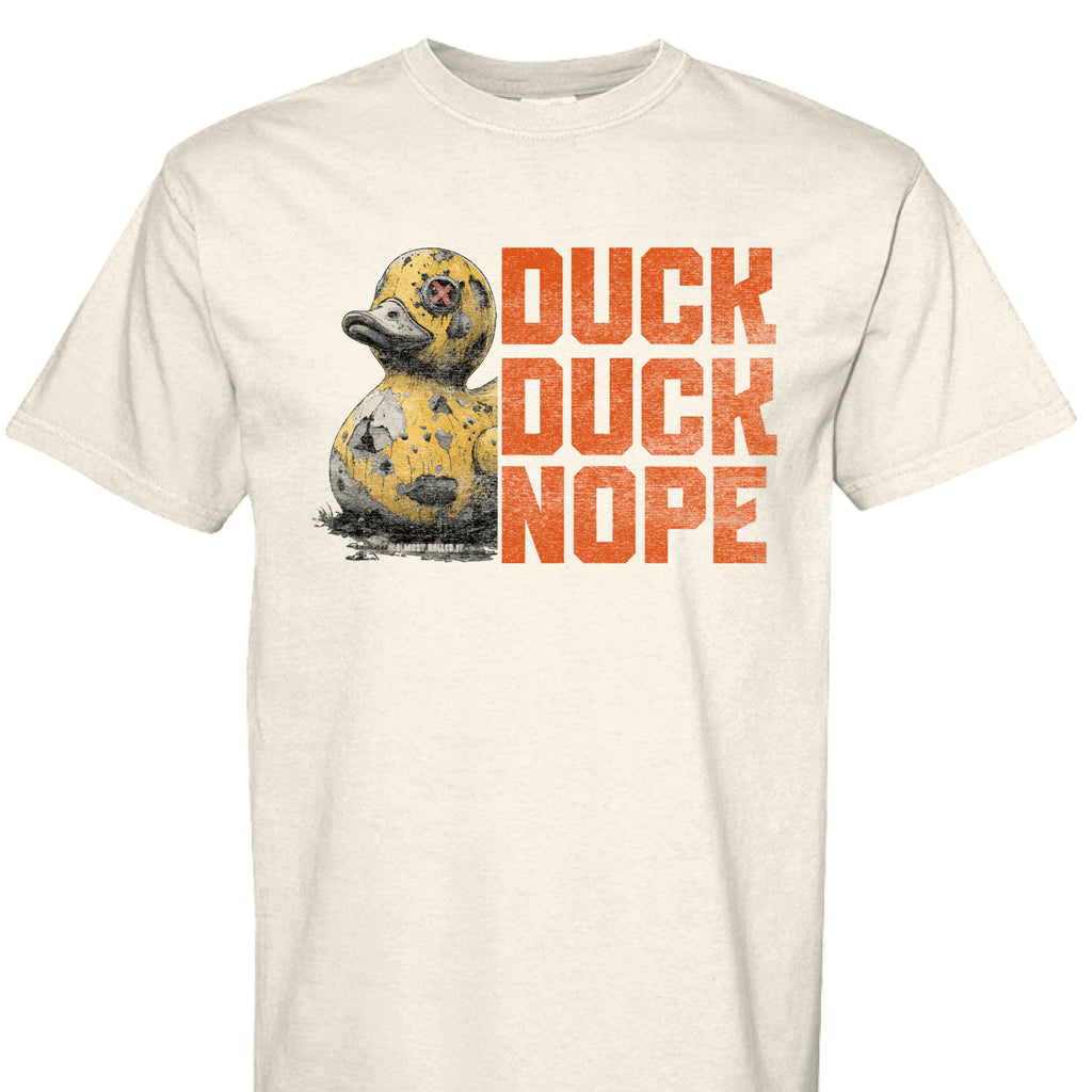 Dark charcoal graphic t-shirt featuring the 'Duck Duck Nope' design in a hand-detailed, gritty style for off-road enthusiasts. - IVORY - FRONT