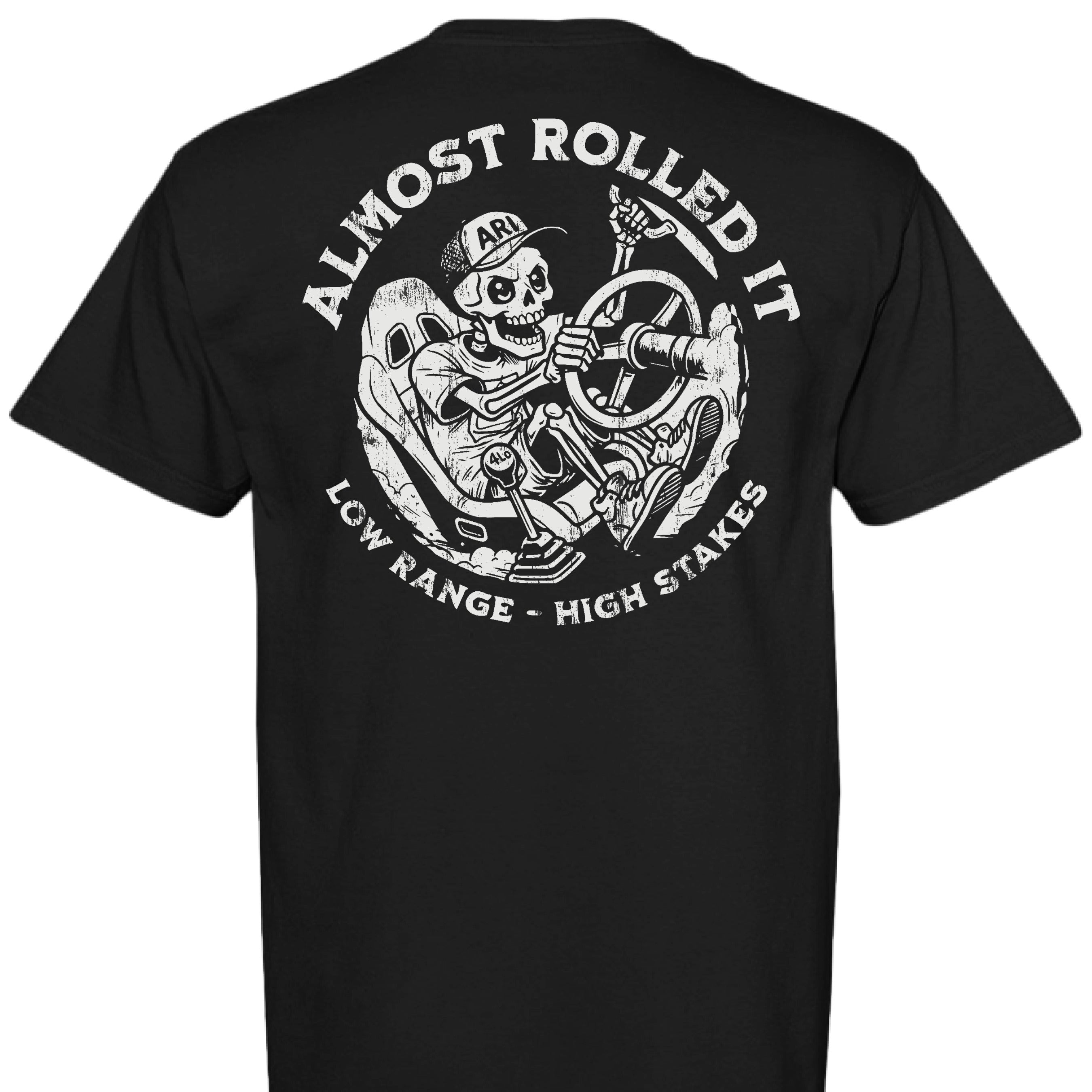 White Comfort Colors t-shirt featuring the Skelly skeleton graphic driving a rock crawler with the left rear tire climbing a technical ledge. - Garment-dyed Comfort Colors t-shirt featuring the Skelly LRHS skeleton rock crawling graphic from Almost Rolled It. - BLACK - BACK