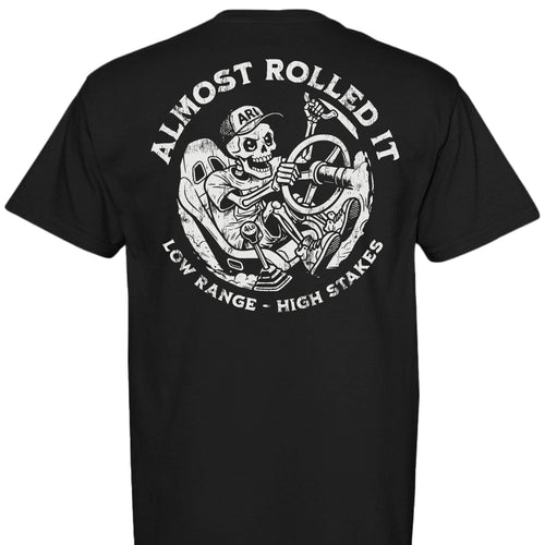 White Comfort Colors t-shirt featuring the Skelly skeleton graphic driving a rock crawler with the left rear tire climbing a technical ledge. - Garment-dyed Comfort Colors t-shirt featuring the Skelly LRHS skeleton rock crawling graphic from Almost Rolled It. - BLACK - BACK
