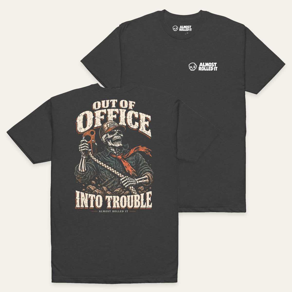 Out of Office Tee in Charcoal — paired flat lay, back lower left and front upper right. Supplier-derived product mockup.