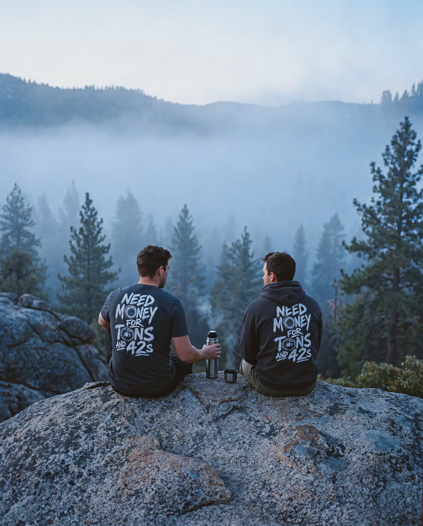 Fog drifting past two friends in Tons & 42s on a granite boulder